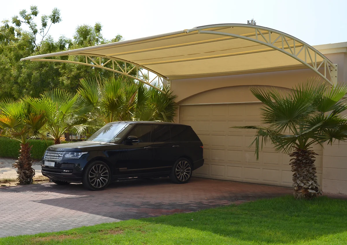 wall mounted parking shade UAE - car parked under durable wall mounted parking shade - Wall Mounted Parking Shade - Alfares International Tents
