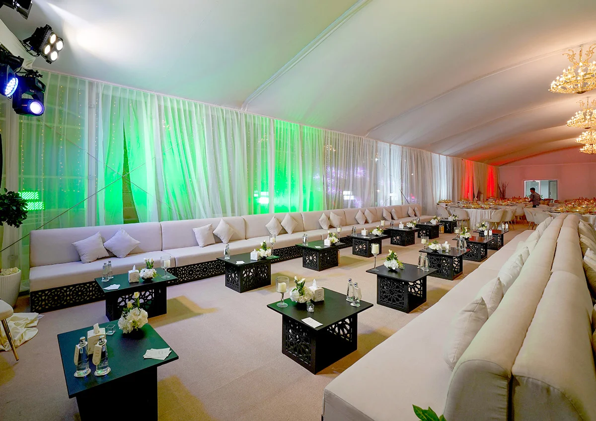 wedding marquee UAE - Arch tent with elegant tables and VIP sofas create a cheerful atmosphere - Wedding Marquee - Alfares International Tents
