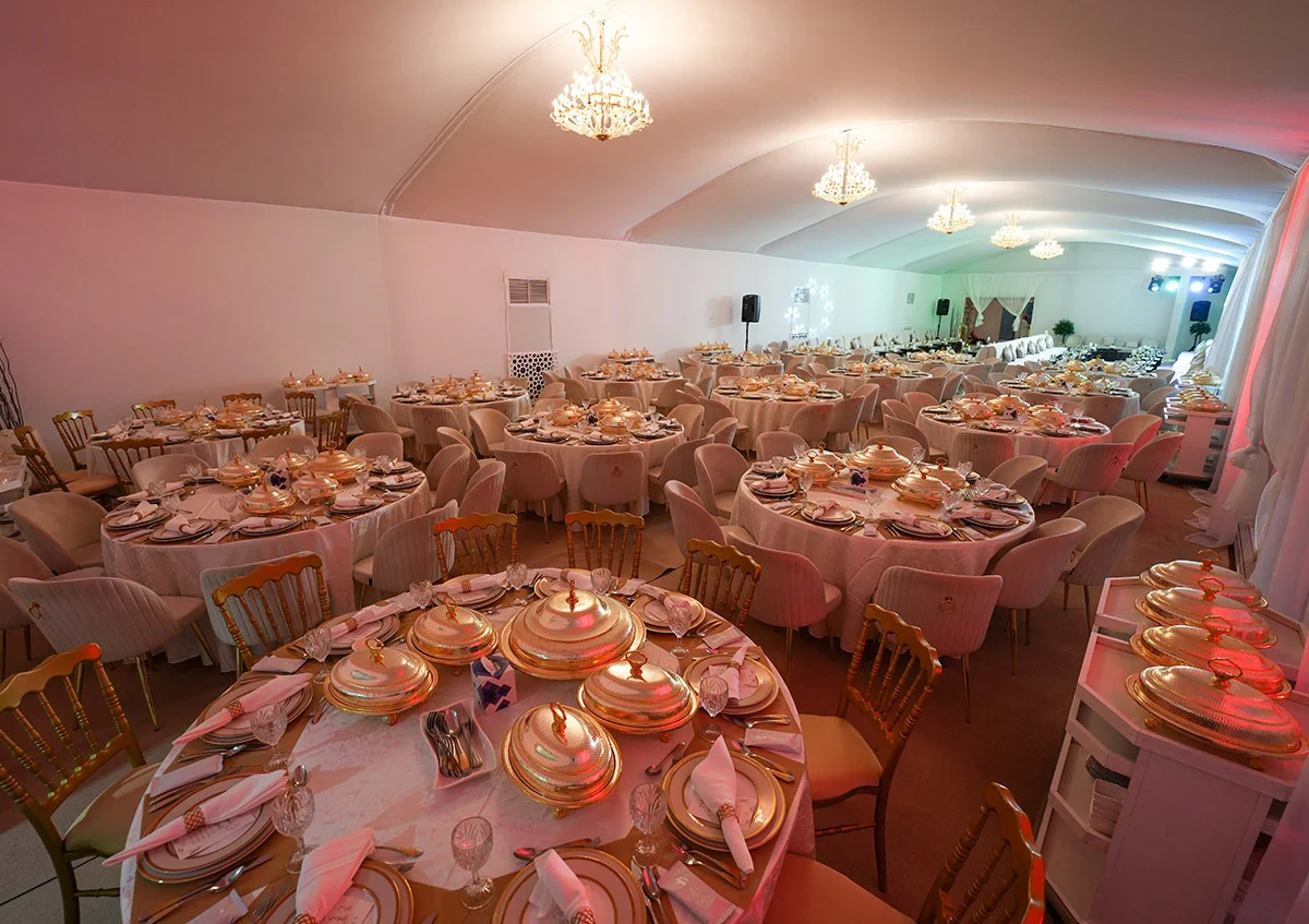 wedding marquee UAE - Arch tent with elegant tables and chairs create a cheerful atmosphere - Wedding Marquee - Alfares International Tents