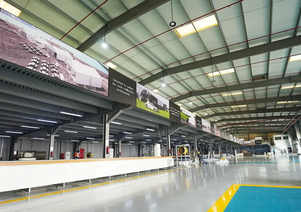 steel structures in tent engineering - Interior of warehouse steel structure - The Role of Steel Structures in Modern Tent Engineering - Alfares International Tents