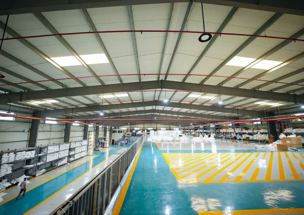 steel structures in tent engineering - Interior of warehouse steel structure - The Role of Steel Structures in Modern Tent Engineering - Alfares International Tents